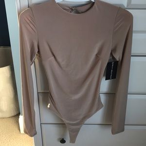 Tan stretchy bodysuit with open back